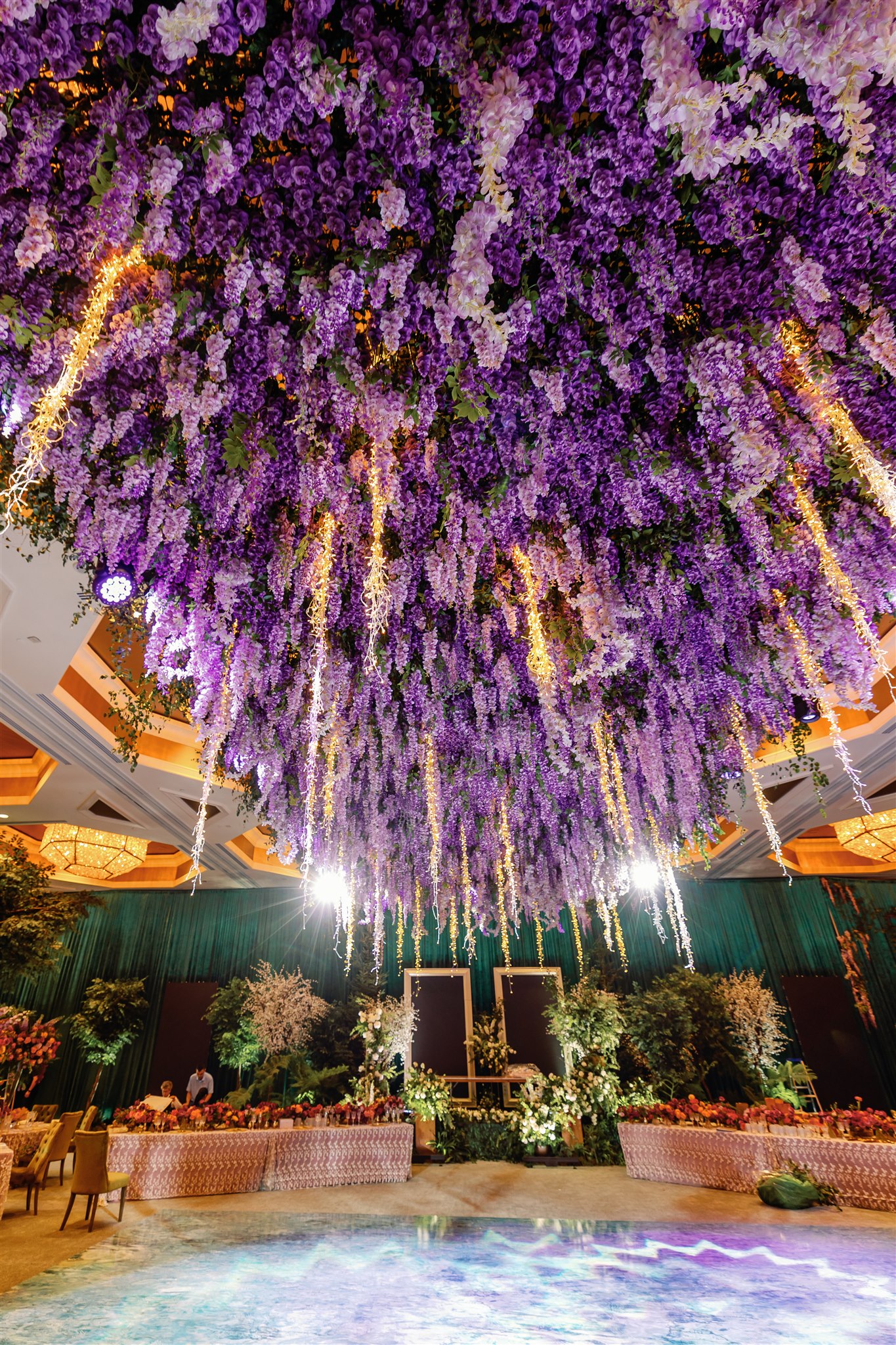 Cascading purple wisteria floral canopy at Four Seasons Orlando luxury wedding by David Tutera - Photo by Alex Paul Photography