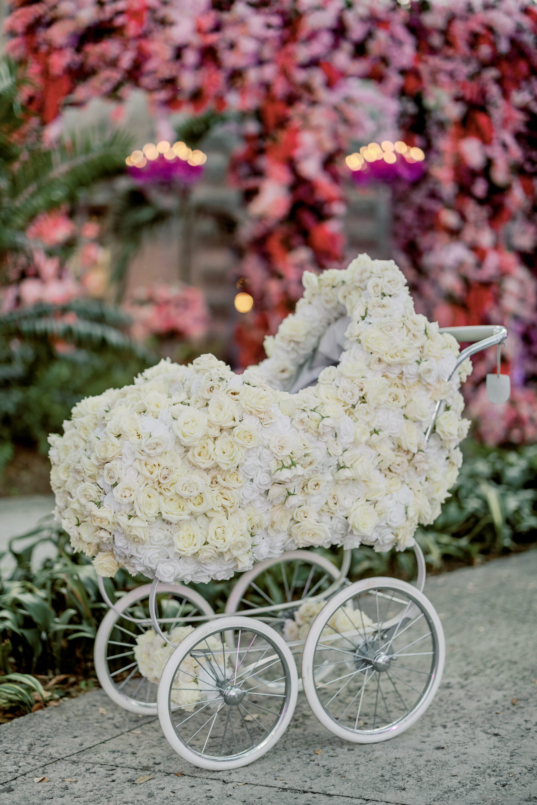Flower-covered baby carriage at Vizcaya ceremony entrance