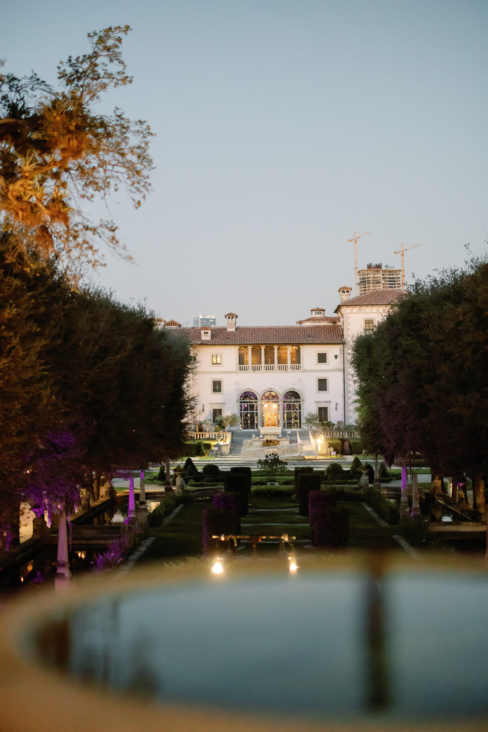 Vizcaya estate exterior lit at night from the gardens
