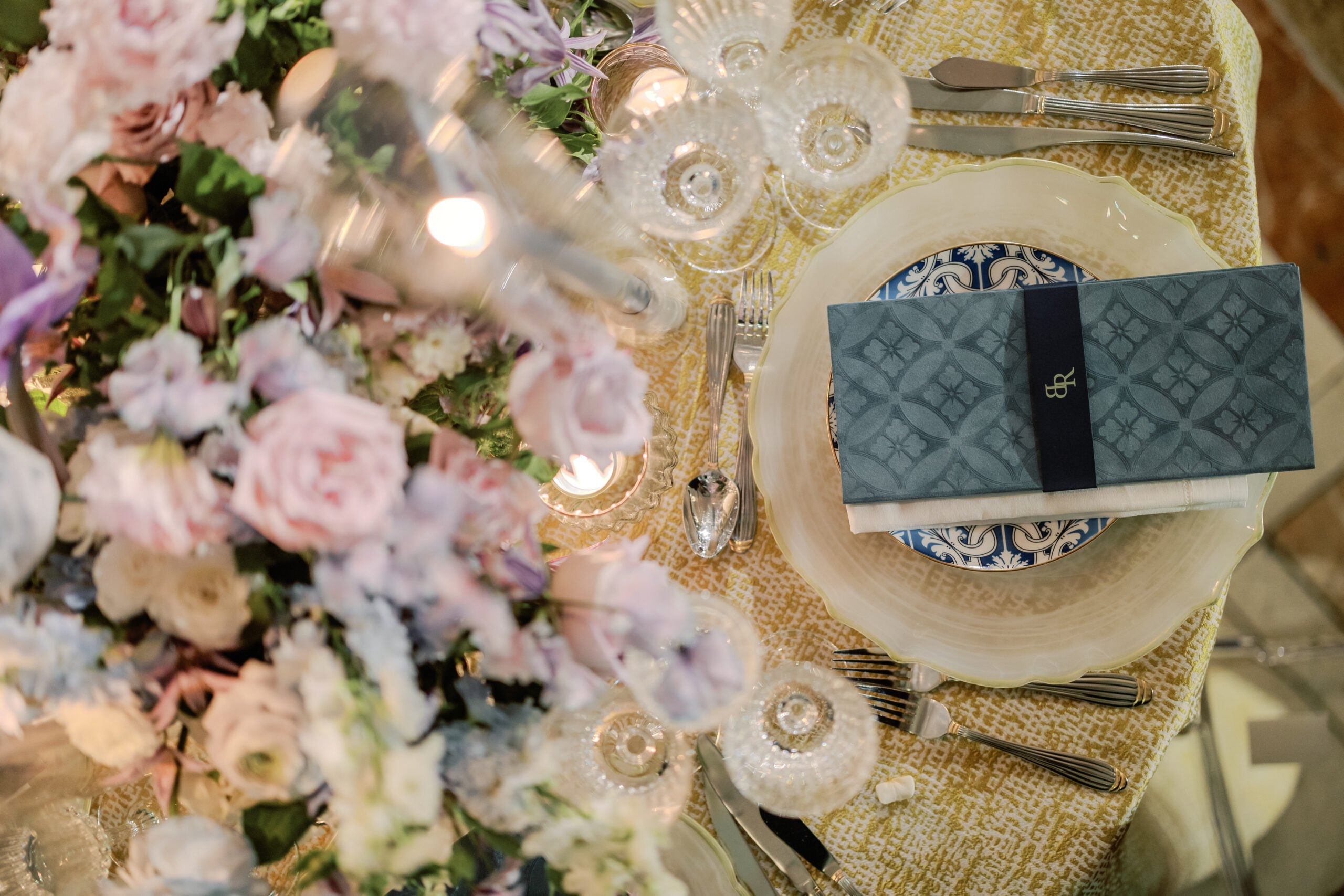 Tablescape with candles and lavender floral centerpiece