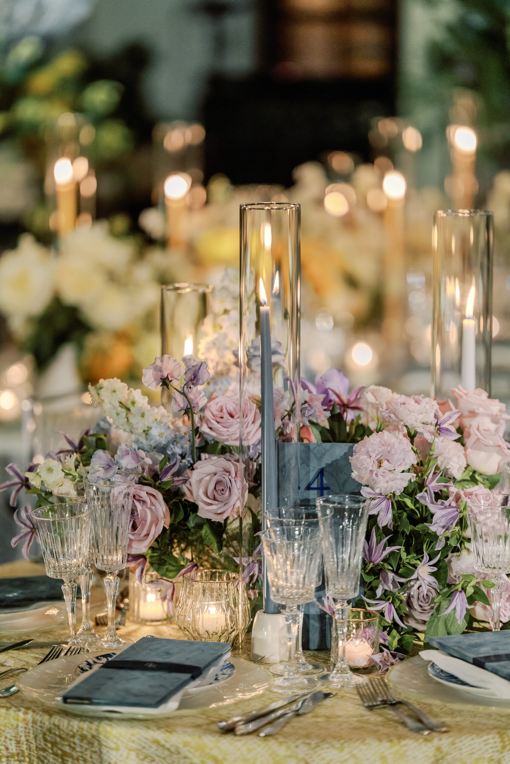 Place setting detail with monogrammed menu and florals